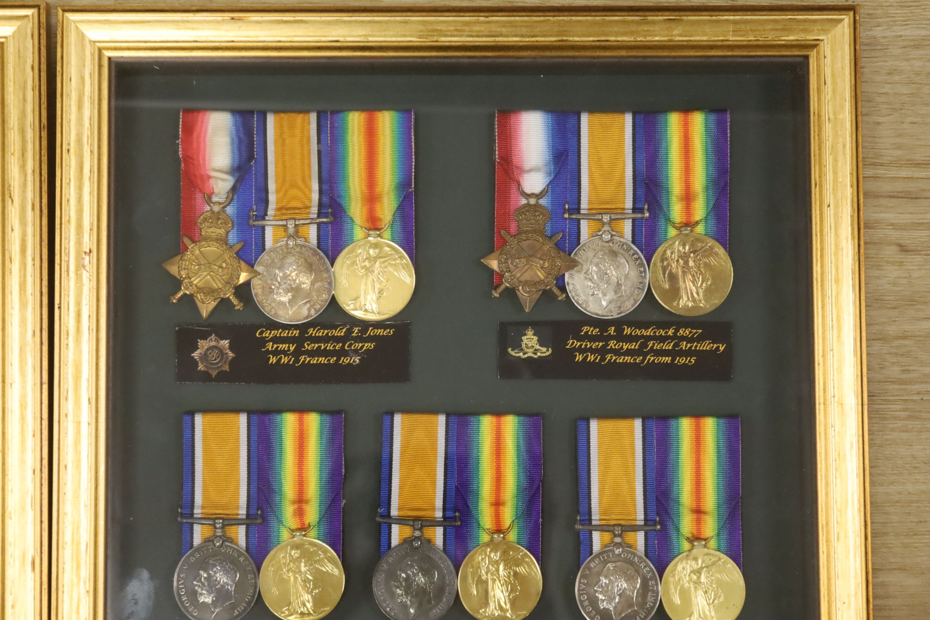 Two framed collections of WW1 medal groups